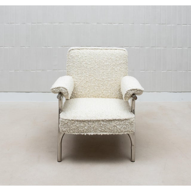 The Ramo Armchair by R&Y Augousti is a celebration of modern luxury and timeless comfort. Upholstered in sumptuous cream...