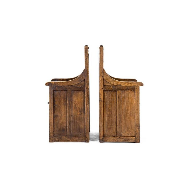 An impressive pair of gothic revival arts and crafts box seat armchairs from the scottish arts and crafts movement. The...