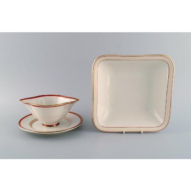 Christian Joachim for Royal Copenhagen. "The Spanish pattern". Bowl and sauce boat in hand-painted porcelain. Produced...