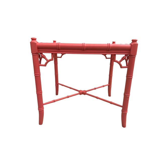 Bold vintage Palm Beach style faux bamboo table featuring a vibrant bright pink and orange finish with classic coastal...