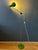 Apple green mid century floor lamp with adjustable arm. The design allows you to position the arm at a different height...