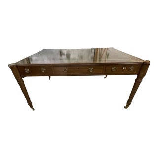 1980s Baker Mahogany Partners Desk With Olive Green Leather Top and Brass Wheels For Sale