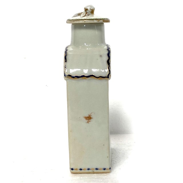 DETAILS An antique tea caddy with a rectangular body, curved shoulder and straight neck. Decorated with a pseudo-armorial...