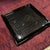 An elegant black lacquer small square tray with a tight pattern of woven black lines that create lovely small square...