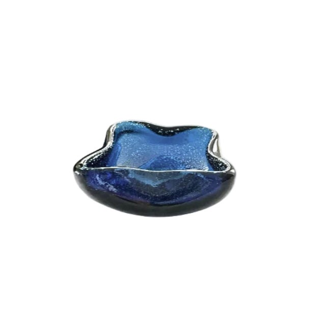 Murano-style hand-blown glass dish in vibrant blue, featuring the controlled bubble (bullicante) technique. c. 1950s- 60s....