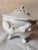 This is a lovely French Deshoulieres tureen made of porcelain with grape vine handles and fruit decoration yet with a...