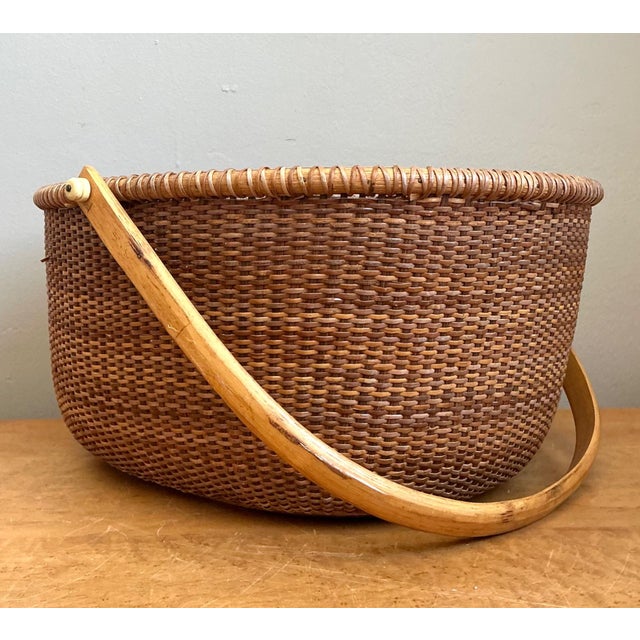 This vintage Shaker-style woven rattan basket exemplifies the enduring appeal of honest materials and purposeful design....
