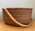 This vintage Shaker-style woven rattan basket exemplifies the enduring appeal of honest materials and purposeful design....