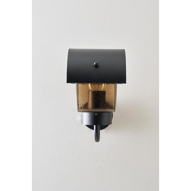 This outdoor wall lamp produced by the german manufacturer bega, known for their uncompromising quality and functional...