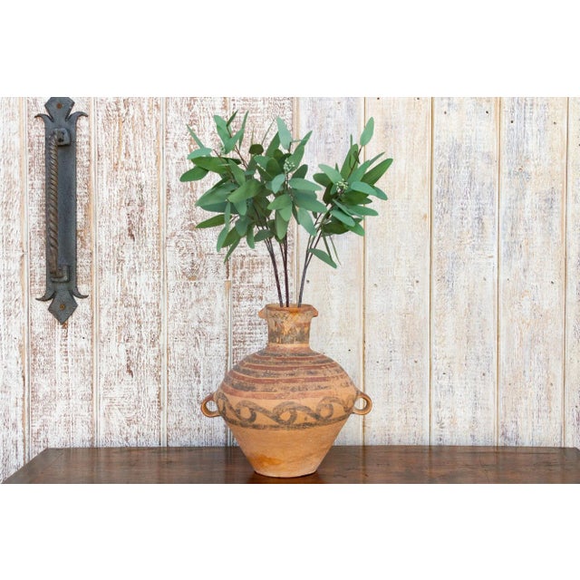 A beautiful country style Chinese earthenware water jug. This antique terra cotta vase features a geometric and lineal...