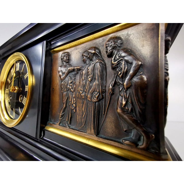 A classic 19th-century mantel clock from the renowned Parisian workshop of Ferdinand Barbedienne. The casing, crafted from...