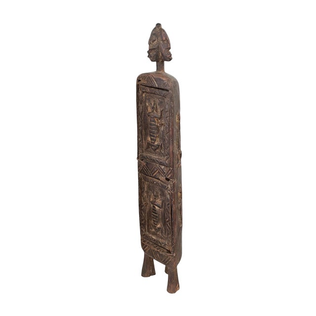 Superb and unique hand-carved wooden box from the Dogon tribe of Mali, featuring a double-door design traditionally used...