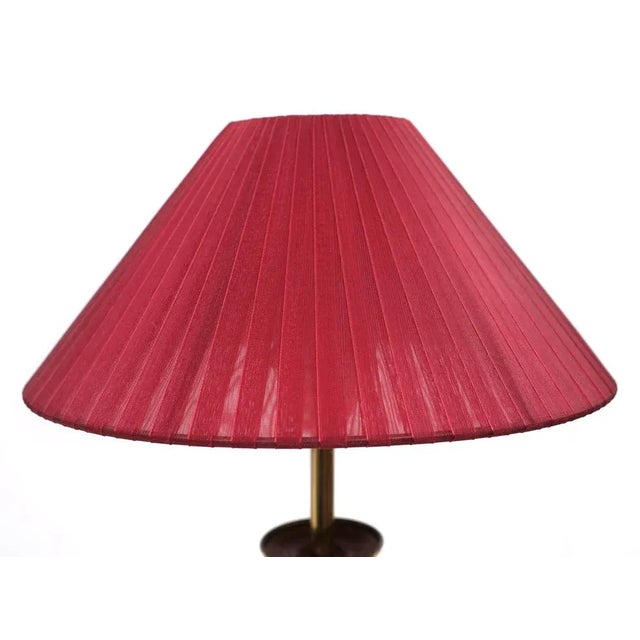 Two very nice brass table lamps comes with new red shades. Switch on the cord. Sleek design. Signed ATD. European Plug (up...