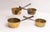 Four antique graduated brass hearth pans with iron riveted handles. The pans stack nicely like a set and the three...