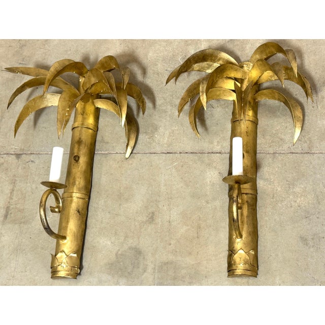 Pair Jansen Style French Gilt Tôle Palm Tree Two-Light Wall Sconces, Circa 1960s France, mid-20th century 32 in. H × 16...