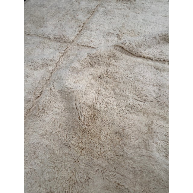 This exceptional Moroccan Beni M’rirt rug represents the pinnacle of Berber craftsmanship, handwoven with the finest...