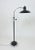 Beautiful Art Deco black and chrome floor lamp. The adjustable black enamel shade has four chrome discs for a very Deco...