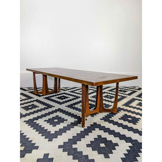 Gorgeous American Walnut cocktail table from the iconic Broyhill Furniture Co. Attributed Circa 1960's. Actual collection...