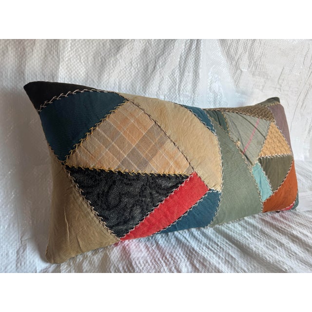 Celebrate American folk artistry with this charming handstitched patchwork pillow, crafted using a mix of vintage fabric...