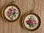 A pair of lovely handmade petit point embroideries featuring colorful pink roses and a blue bird. Circa 1960s/70s. Each is...
