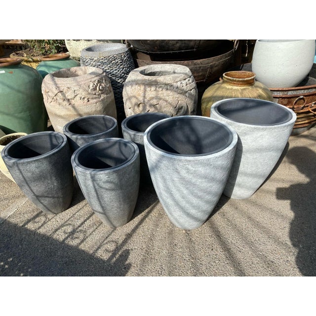 Lightweight cement mix planter with rough scratched texture. Includes black planter insert. Each slightly unique. Each...
