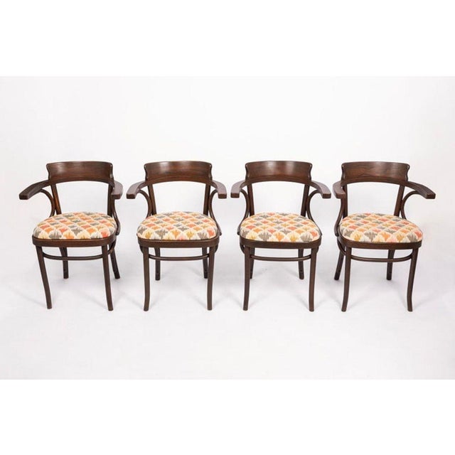 This set of four Vienna Secessionist (Jugendstil) style beech bentwood cafe armchairs are in the style of Jacob & Josef...