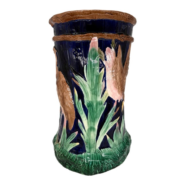 A Majolica Garden Seat by Simon Fielding, of cylinder-shape with a pair of relief molded storks in marsh to either side,...