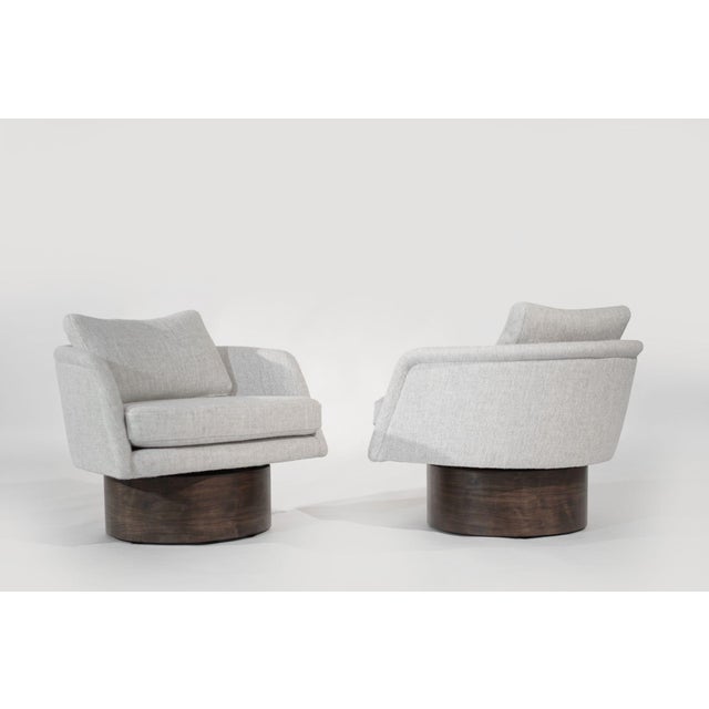 Set of vintage swivel chairs by Leon Rosen for Pace, circa 1970s. Expertly restored by Stamford Modern, featuring walnut...