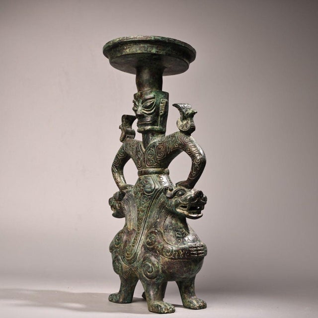 This is a striking and unusual vintage Chinese bronze oil lamp, crafted in the archaic ritual style of the Shang and Zhou...