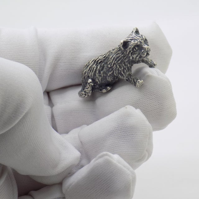 Exuding an endearing charm and quiet warmth, this vintage silver miniature figurine depicts a sweet kitten in a gentle...
