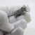 Exuding an endearing charm and quiet warmth, this vintage silver miniature figurine depicts a sweet kitten in a gentle...