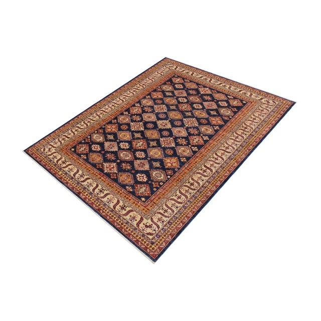 Enhance your home with this exquisite hand-knotted Super Kazak rug, crafted from fine hand-spun wool and dyed with all-...