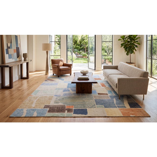Elevate your interior with this exceptional contemporary hand-knotted wool area rug, featuring a sophisticated, modernist...