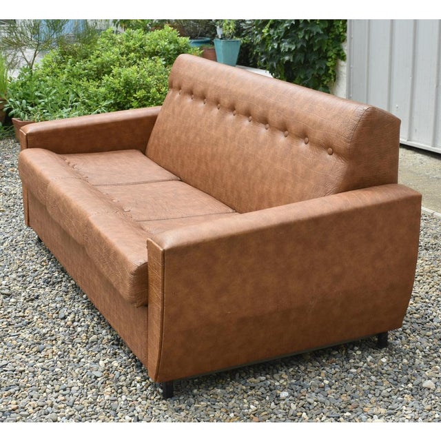 An all original three piece suite from the 1960s. Made in France, this set is upholstered in faux leather / leatherette...
