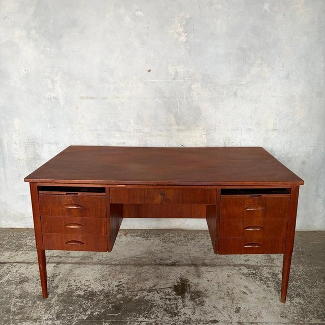 A substantial mid-century Danish-style teak twin pedestal executive desk dating from the 1960s. Designed to be viewed from...