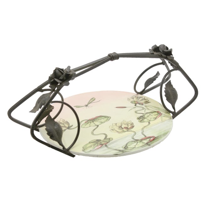 This unusual Belgian piece has the hallmarks of Art Nouveau and combines a ceramic gateau plate in a wrought iron carrier,...