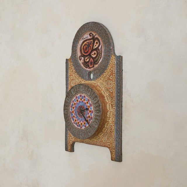 A 1970s ceramic wall clock by Jacques Poussine, produced at the Sant-Vicens workshop in Perpignan, France. The piece is...