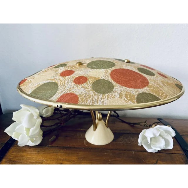 Crack in canopy (invisible when lamp is hung). This piece has an attribution mark, I am sure that it is completely...