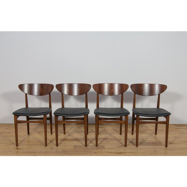 The set of four chairs was produced in Denmark in the 1960s. The chairs have an interesting form combined with high...