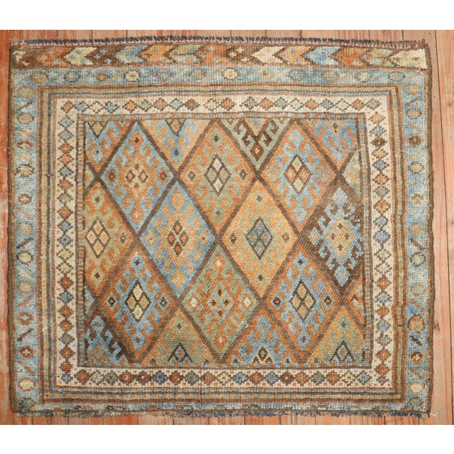 An early 20th-century mini-size Kurd Jaff rug Measures: 2' x 2'4".