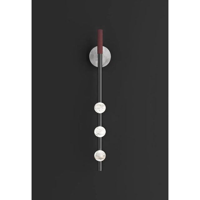 Demetra shiny black metal wall lamp by alabastro italiano dimensions: d 9 x w 10 x h 60 cm. Materials: white alabaster,...