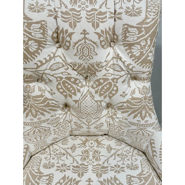 A sophisticated pair of Thomas Pheasant-designed side chairs for Baker Furniture, newly upholstered in designer textiles....