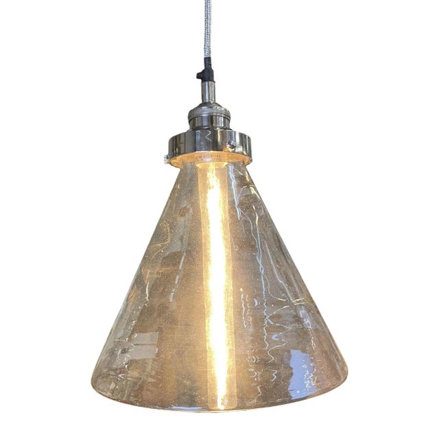 Modern industrial lamp silver brushed ceiling pendant with clear glass cone shade. Featuring a blown clear glass shade...