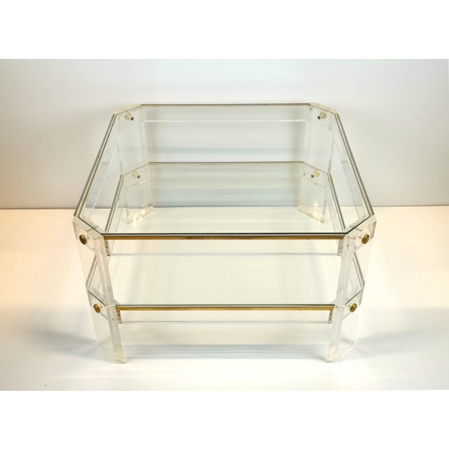 Elevate your living space with this striking 1970s Hollywood Regency coffee table. The piece stands out with its elegant...
