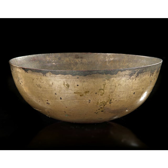 Engraved bowl with benedictory Kufic rim band Of deep form with curved edges, engraved to the interior with a central...
