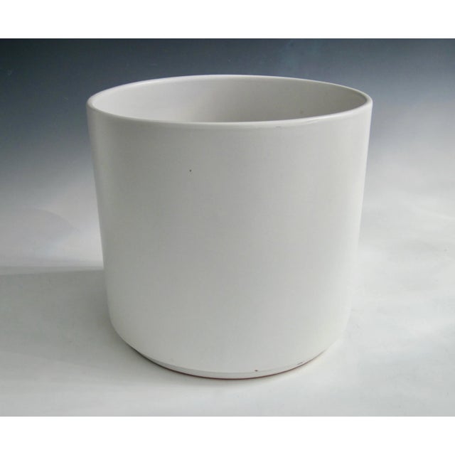 A semi-matte white glazed terra cotta planter pot. Minimalist in form and functional in use. Good condition, consistent...