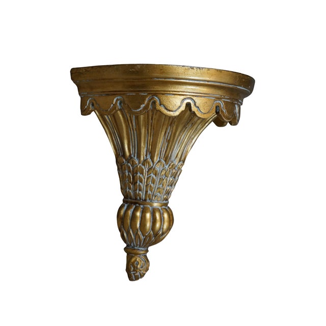 Pair of early 21st century gilt composite wall brackets / sconces / shelves, featuring tapered torch shaped bases with a...