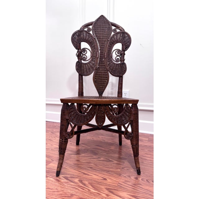 This is an antique decorative accent chair featuring various materials stylized in a fanciful way with nods to Victorian,...