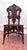 This is an antique decorative accent chair featuring various materials stylized in a fanciful way with nods to Victorian,...