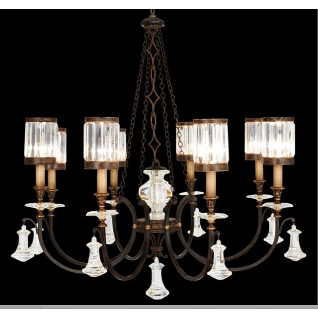 Traditional rustic iron 8 light chandelier with faceted channel set crystal glass shade. Total Wattage: 480 w. Height:...